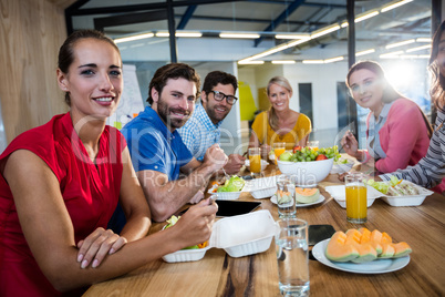 Casual business team eating together