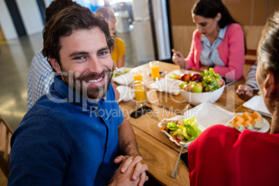 Casual business team eating together