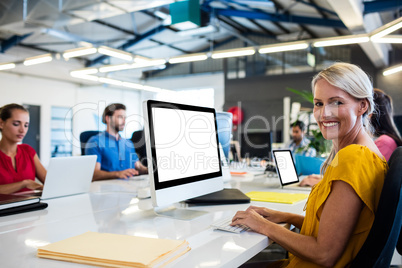 Casual business people working on computer