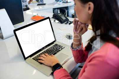 Casual businesswoman using a laptop Casual businesswoman using a laptop