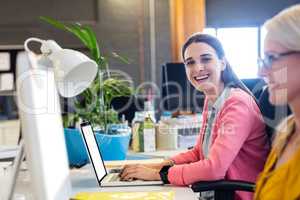 Casual businesswomen using technology