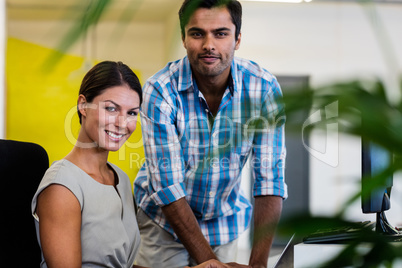 Casual colleagues smiling at camera