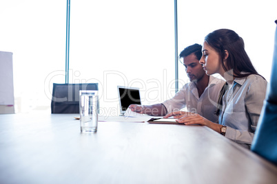 Colleagues reading documents