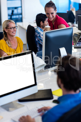 Casual colleagues using computer