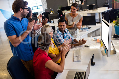 Casual colleagues clapping their hands