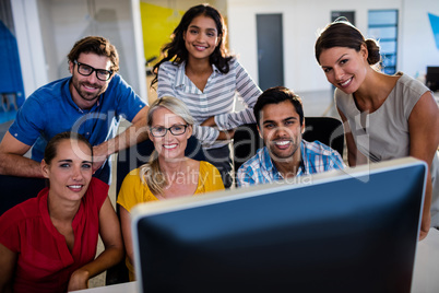 Casual colleagues smiling at camera