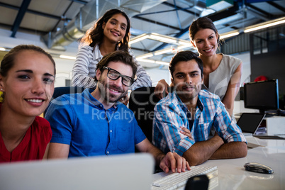 Casual colleagues smiling at camera