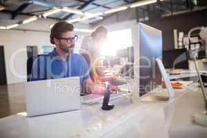 Casual businessman using computer