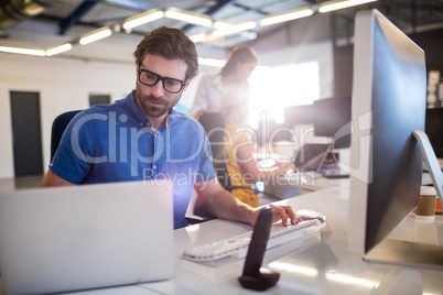 Casual businessman using computer