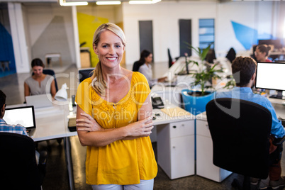 Casual businesswoman with arms crossed Casual businesswoman with arms crossed