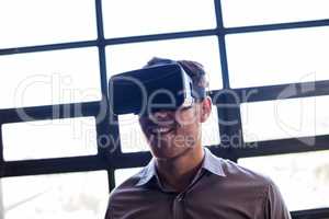 Businessman using virtual reality device