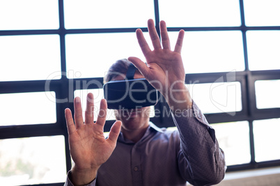 Businessman using virtual reality device