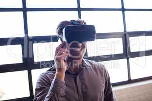 Businessman using virtual reality device