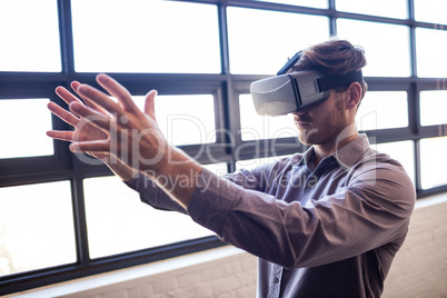 Businessman using virtual reality device