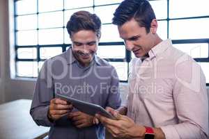 Businessmen using a tablet