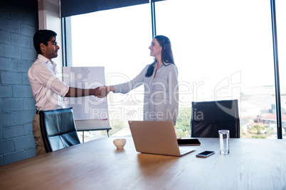 Business people shaking their hands