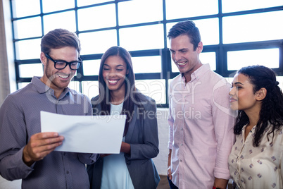 Colleagues holding a document