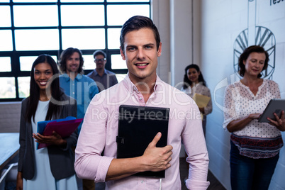 Group of coworkers with folders