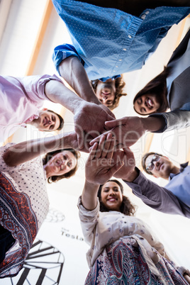 Portrait of a crew of hipster putting hands together