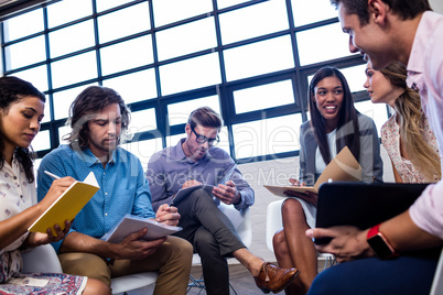 Group of coworkers with folders interacting