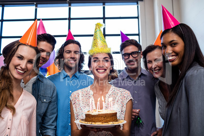 Happy coworkers celebrating a birthday