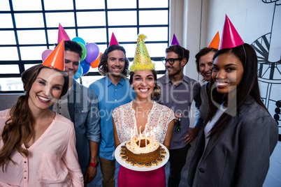 Happy coworkers celebrating a birthday