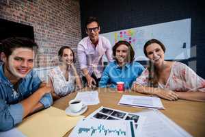 Portrait of a group of coworkers during meeting