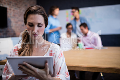 Creative businesswoman using a tablet computer