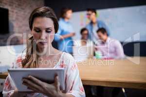 Creative businesswoman using a tablet computer