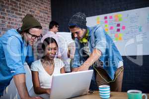 Group of hipsters using a computer