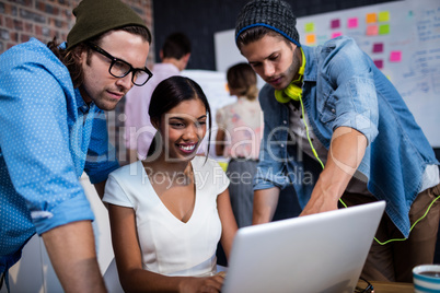 Group of hipsters using a computer