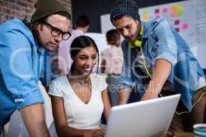 Group of hipsters using a computer