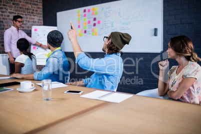 Manager leading a meeting with a group of creative designers