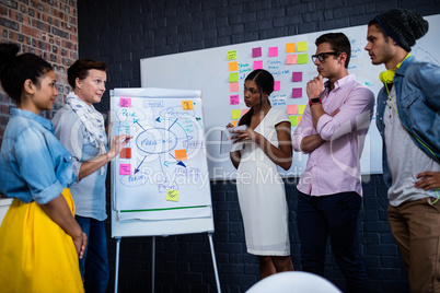 Manager leading a meeting with a group of creative designers