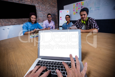 Photograph of a group of hipsters with laptop