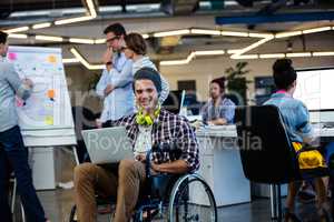 Designer in a wheelchair with a computer