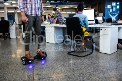 Hipster on a smart balance board