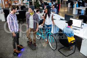 Hipsters with bicycle, skate and smart board