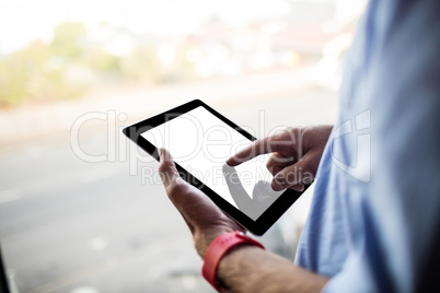 Hand using tablet computer
