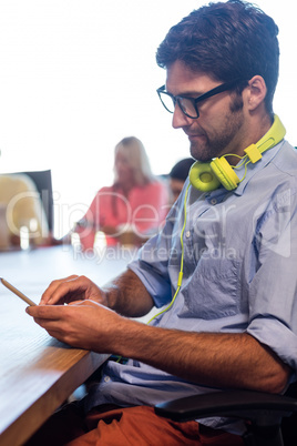 Hipster scrolling laptop