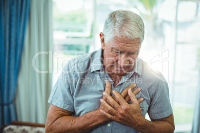 Senior man suffering from chest pain