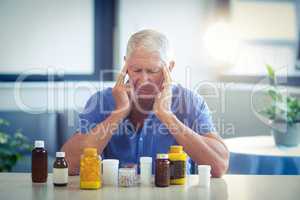 Senior man suffering from headache