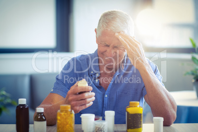 Senior man suffering from headache