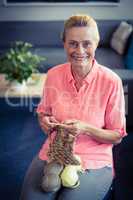 Portrait senior woman knitting wool