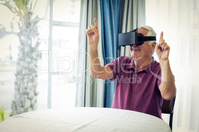 Senior man wearing virtual glasses