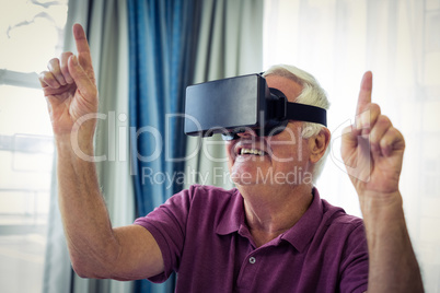 Senior man wearing virtual glasses
