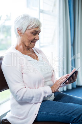 Senior woman using digital tablet