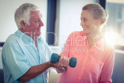 Senior couple exercising at home