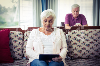 Senior woman using digital tablet