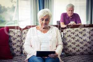 Senior woman using digital tablet